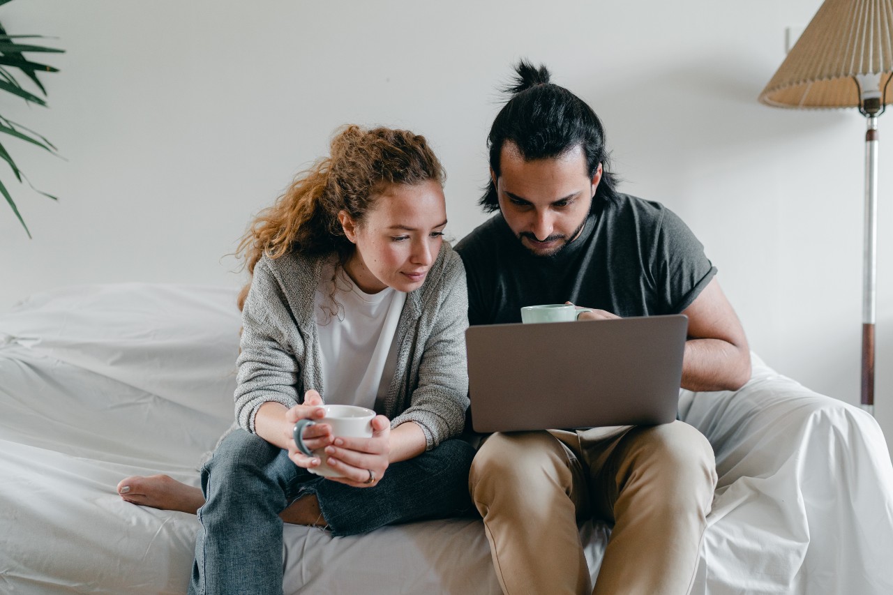 Couple looking on computer for real estate in Vancouver